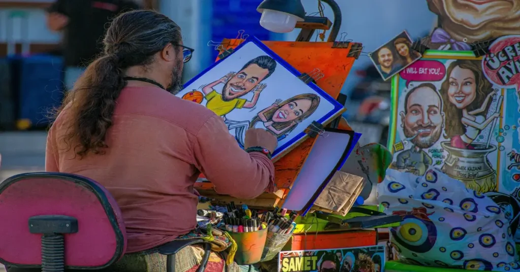 فنان شارع يرسم كاريكاتير ملون يعكس فن الرسوم الساخرة والإبداع الفني